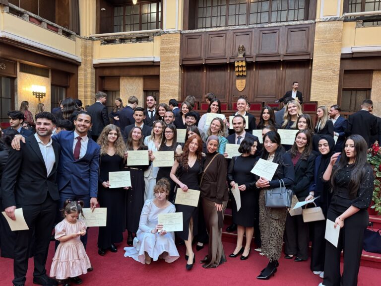 Students holding certificates at a Comenius University matriculation ceremony in Bratislava